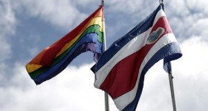 Rainbow flag, which symbolises sexual diversity, is seen after being raised by Costa Rica's President Guillermo Solis, next to Costa Rica's national flag at presidential house in San Jose